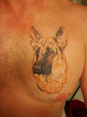 Dog Head Tats On Chest